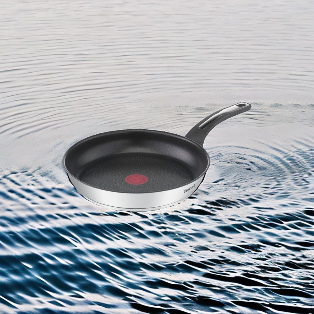 A dynamic "face-off" style image featuring the De Buyer, GreenLife, and GreenChef frying pans on a kitchen counter.
